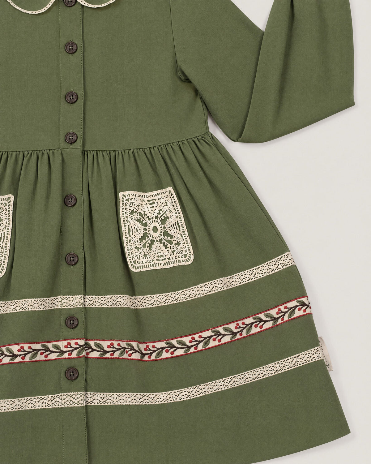 The Garden Dress in Moss — lace pocket and skirt tape detail