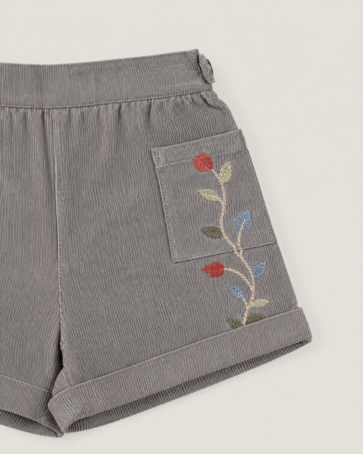 The Garden Shorts in Pewter — embroidered pocket detail