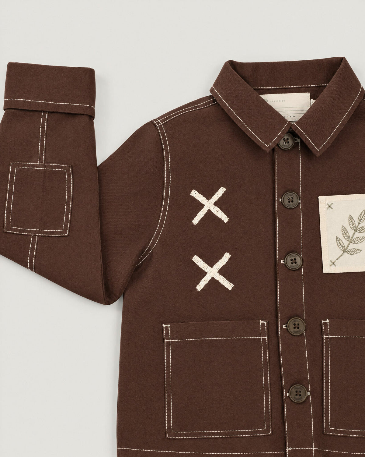 The Grid Overshirt in Bark — cross-stitch and pocket detail